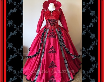 May include: A red and black ball gown with a heart-shaped neckline and black lace trim. The gown has a fitted bodice and a full skirt. The skirt is decorated with black embroidery.