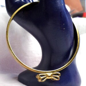Kate Spade Black and Gold Bow Bangles a bundle of three Kate Spade Skinny Mini Bow Bangle Bracelet, Black main image 3