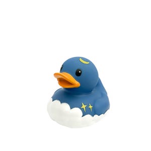May include: A blue rubber duck with a crescent moon and stars on its chest, sitting on a white cloud.
