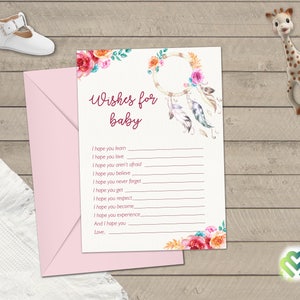 May include: A white card with a pink floral design and a dreamcatcher with feathers. The card has the text "Wishes for baby" and a list of wishes for a baby.