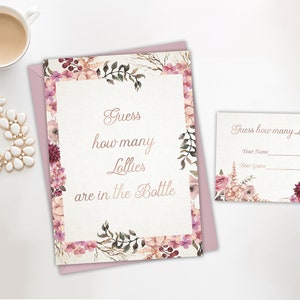 May include: A pink floral card with the text "Guess how many Lollies are in the Bottle". A smaller card with the text "Guess how many Lollies?" and blank lines for a name and guess.