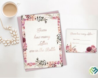 May include: A pink floral card with the text "Guess how many Lollies are in the Bottle". A smaller card with the text "Guess how many Lollies?" and blank lines for a name and guess.