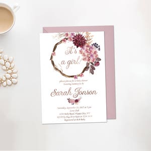 May include: A pink and white floral baby shower invitation with a wreath and the text "It's a girl!"  Please join us for a baby shower honoring mommy-to-be Sarah Jonson. Saturday, September 21, 2017 at 5pm. Love Chub, 1234 Baby Road, Happy City, NY. RSVP by: Aug 20 to 1234 5678. Registered at BB Baby.