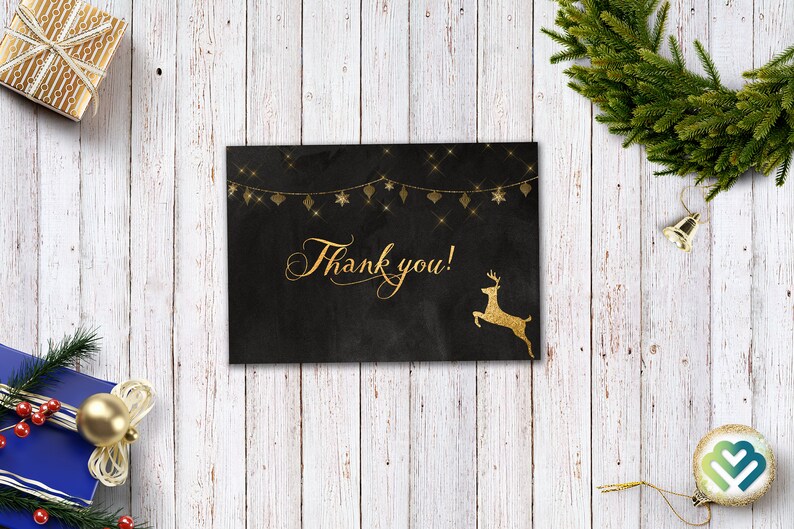 May include: A black card with gold glitter and a gold reindeer silhouette. The card says "Thank you!" in gold script.