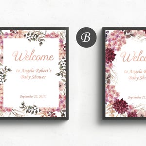 May include: Two printable welcome signs for a baby shower with floral borders. The signs feature the text "Welcome to Angela Robert's Baby Shower" and the date "September 22, 2017".