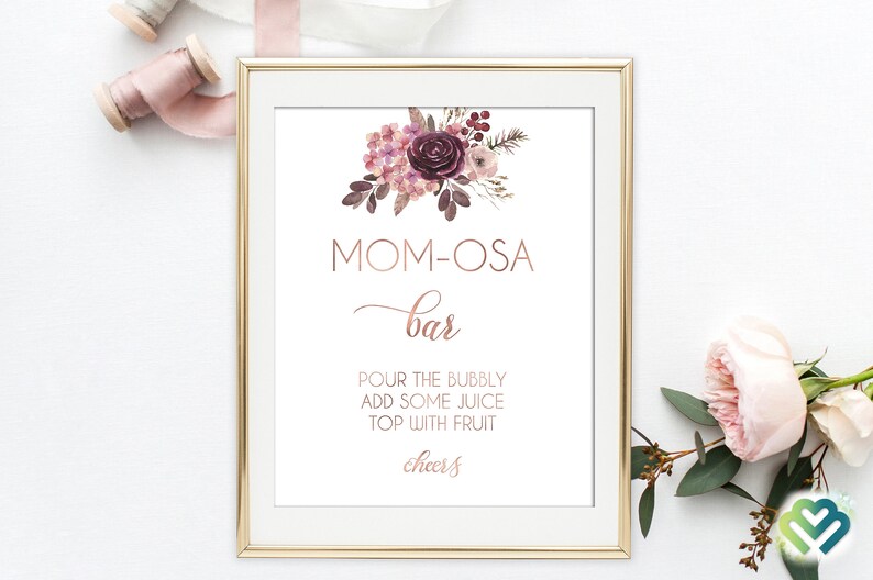May include: A printable sign for a "Mom-osa Bar" with a floral design in shades of pink and purple. The sign instructs guests to "Pour the bubbly, add some juice, top with fruit, cheers!"
