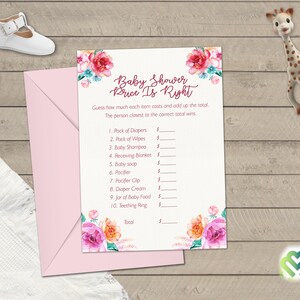 May include: A pink and white baby shower game card with floral illustrations. The game is called "Price is Right" and asks players to guess the price of various baby items.