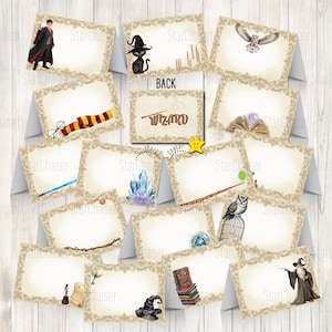 May include: A collection of rectangular folded cards featuring ornate gold borders and various wizard-themed illustrations including a student in robes, a black cat, an owl, a scarf, glasses, crystals, a wand, a cage, and the word WIZARD.