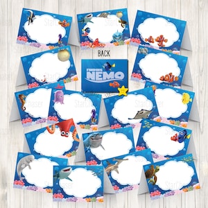 May include: A collection of Finding Nemo themed folded cards featuring various underwater characters like clownfish, sharks, and sea turtles. Each card has a central white cloud-shaped area for text, surrounded by blue water, coral, and sea life.