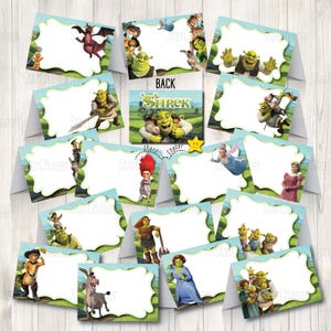 May include: A collection of folded Shrek-themed place cards featuring various characters including Shrek, Donkey, Fiona, and Puss in Boots. Each card has a white scalloped center area for writing names, surrounded by a light blue border and green landscape.