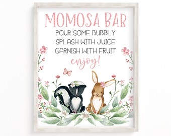 May include: A printable sign for a mimosa bar with a pink floral border and a watercolor illustration of a skunk and a rabbit. The sign reads "MOMOSA BAR POUR SOME BUBBLY SPLASH WITH JUICE GARNISH WITH FRUIT enjoy!"