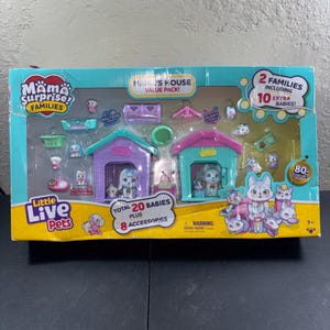 May include: A Little Live Pets Mama Surprise Families value pack box containing two toy houses, one purple and one teal, with multiple small animal figures, including a Maltese and a Husky family, plus eight accessories and a total of 20 babies.