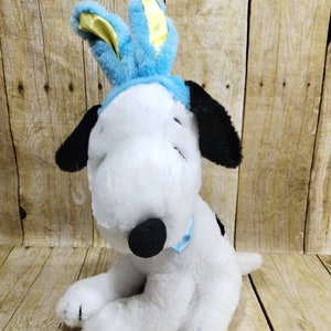 Peanuts Animated Snoopy Easter Bunny Ears Plays Theme Song Neck Swings Around (su1)