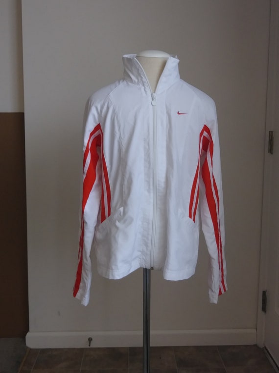 orange and white nike jacket