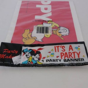 May include: A red party banner with Donald Duck and the word "Happy" printed on it. Below is a black and white banner with Minnie and Mickey Mouse, and the text "It's a Party Banner".