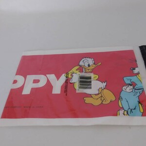 May include: A red and white package featuring Donald Duck and Goofy cartoon characters. The word "PPY" is printed in large white letters. The package has a barcode and text that reads "MADE IN CHINA".