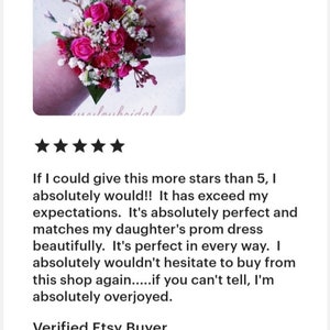 May include: A pink and white flower wrist corsage with pink roses, white baby's breath, and green foliage.  "If I could give this more stars than 5, I absolutely would!! It has exceed my expectations. It's absolutely perfect and matches my daughter's prom dress beautifully. It's perfect in every way. I absolutely wouldn't hesitate to buy from this shop again.....if you can't tell, I'm absolutely overjoyed. Verified Etsy Buyer"