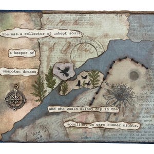 May include: A mixed media art piece featuring layered paper with vintage text, a metal compass charm, and black thread stitching. The text reads: She was a collector of unkept souls, a keeper of unspoken dreams, and she would skinny dip in the moonlight on warm summer nights.