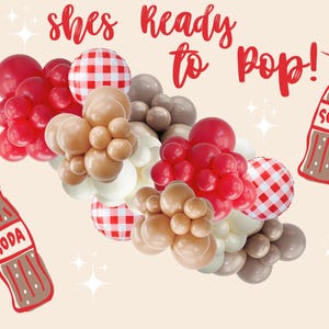 May include: A festive balloon garland in red, white, tan, and gray, with two soda bottle illustrations. The garland includes red balloons, white and tan balloons, and checkered balloons. The text "shes Ready to pop!" is written in red.