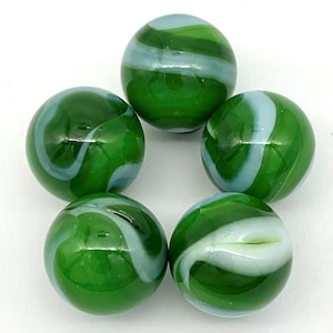 May include: Five green and white swirl glass marbles. The marbles have a white swirl pattern on a green background.