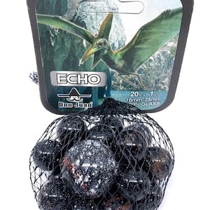 May include: A bag of 20 black and white glass marbles with a red tint. The bag is labeled "ECHO" and "Don Juan" with a logo of a sombrero. The label also states "20 pcs 16mm 25mm 100% GLASS".