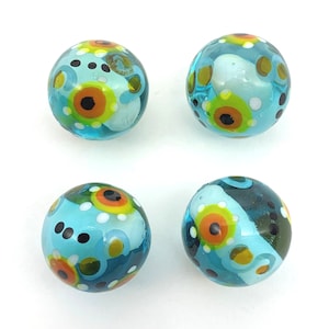 New for 2022!! &quot;Pollination&quot; 16mm Handmade Art Glass Player Marbles (5/8&quot;) Pk 4 Transparent Blue w Colorful Flowers Dots & Swirls w Stands
