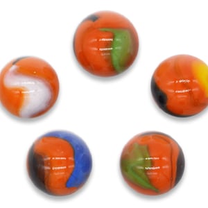 May include: Five glass marbles with orange, green, black, white, and blue swirls. The marbles are arranged in a circle on a white background.