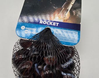 NEW FOR 2025! Rocket Net Bag Glass Marbles 24 16mm player marbles and 1 25mm shooter Translucent Purple with Orange and White Swirls Space