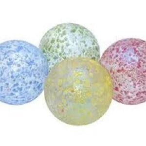 May include: Four glass marbles with a speckled pattern. The marbles are blue, green, yellow, and pink.
