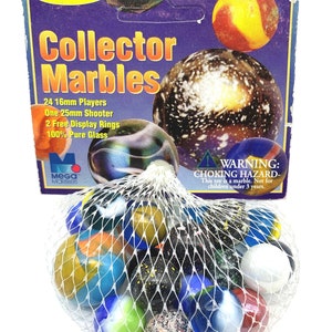 May include: A bag of 24 16mm glass marbles, one 25mm shooter marble, and two display rings. The bag is white with a black net and the marbles are various colors and patterns. The packaging says "Mega Marbles for a New Generation" and "Collector Marbles".