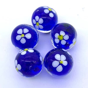 New for 2023! Blue Blossom 16mm Handmade Art Glass Player Marbles 5/8" Choice: Single or Pack of 5 Transparent Blue w White Flowers Vacor