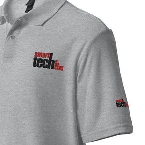 May include: A gray polo shirt with the text "smart tech" embroidered on the left chest and right sleeve.