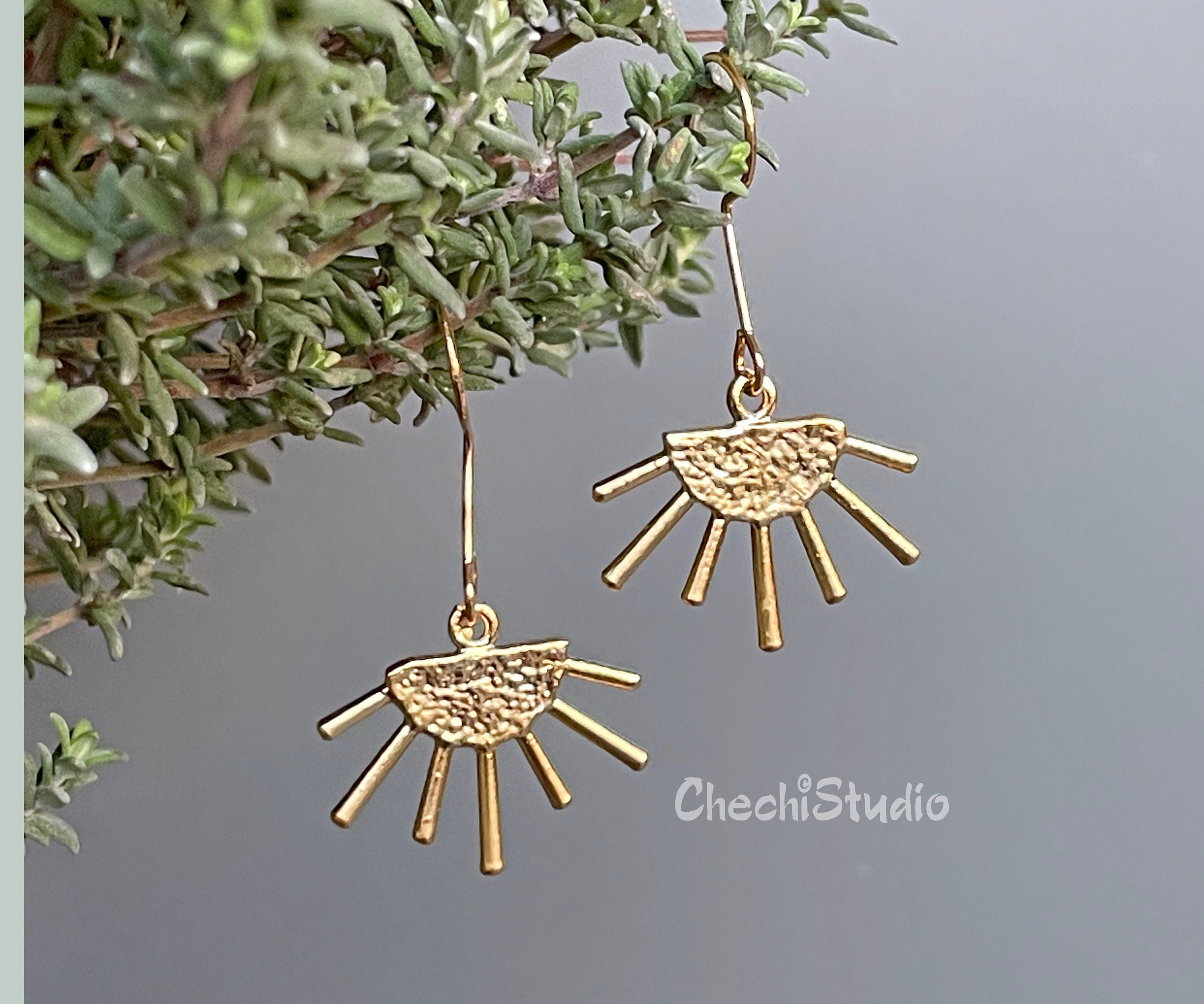 Gold sun earrings deals