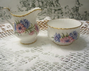 Paragon Bone China Creamer and Sugar Decorated With Blue and Pink Florals/Asters With Gold Trim