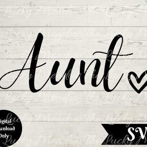 May include: Black script text reading "Aunt" with a heart symbol, set against a white wooden backdrop. A black circle with "Digital Download Only" is in the lower left. A black banner with "SVG" is in the lower right corner.