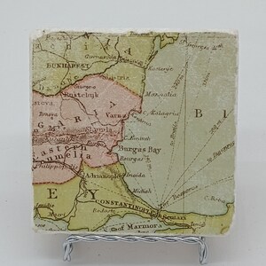 May include: An antique map of Eastern Europe, showing the Black Sea, the Sea of Marmora, and the surrounding regions. The map is printed on paper and has a faded, vintage look. The map includes the cities of Constantinople, Adrianople, Varna, and Rustchuk.