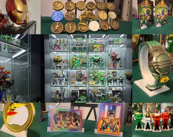 May include: A collection of Power Rangers memorabilia, including action figures, trading cards, and a watch. The collection is displayed on shelves and in glass cases. The items are mostly green and black, with some gold accents.