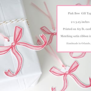 May include: Pink bow gift tags printed on 65 lb. cardstock. Each tag measures 2 x 3.25 inches and includes a matching satin ribbon. Handmade in Orlando, FL.