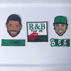 May include: A collection of five embroidered patches featuring two male portraits, a rectangular patch with the text R&B Tour 26' and a red lip graphic, a green rectangular patch with the text USHER, and a green patch with the text BREEZY.