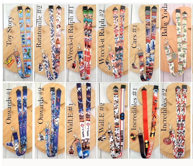 May include: A collection of twelve fabric lanyards featuring various animated movie themes including Toy Story, Ratatouille, Wreck-it Ralph, Cars, Baby Yoda, Onwards, Wall-E, and The Incredibles. Each lanyard includes a metal clasp and a character charm.
