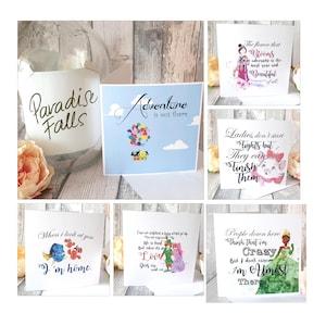 May include: Six different greeting cards featuring Disney characters and inspirational quotes. The cards are white with colorful illustrations and text. The quotes include "Adventure is out there", "The flower that blooms in adversity is the most rare and beautiful of all", "Ladies don't start fights but they can finish them", "When I look at you I'm home", "Our life is a happy world go by, the days brush by, but when its bad taken its toll, love goes on and on", and "People down here think that I'm crazy but I don't care I'm almost there".
