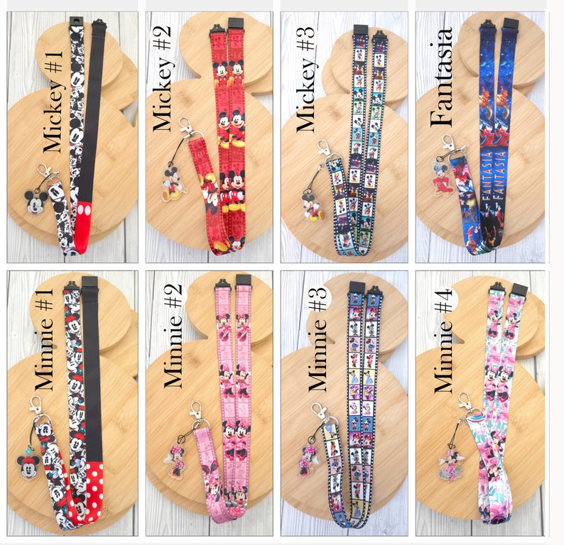 May include: A collection of eight fabric lanyards featuring various Disney character prints including Mickey Mouse, Minnie Mouse, and Fantasia. Each lanyard includes a black plastic buckle, a metal lobster clasp, and a clear acrylic character charm.
