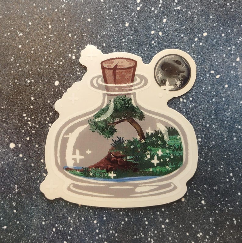 May include: A sticker featuring a whimsical scene inside a glass bottle. The bottle contains a miniature landscape with a tree, water, and greenery. A cork seals the bottle, and a moon graphic is attached. The sticker has a white border and is set against a starry background.