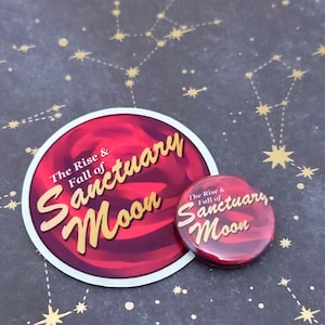 May include: A sticker and a button featuring the text "The Rise & Fall of Sanctuary Moon" in gold script. The sticker and button have a red and maroon background with a white border. The background is a dark blue with gold star constellations.