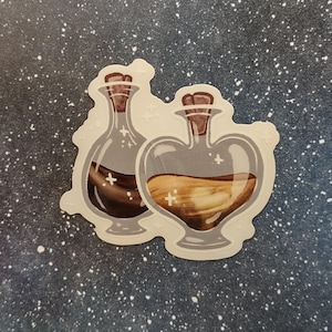 May include: A sticker featuring two potion bottles. One bottle is heart-shaped and filled with a light brown liquid, while the other is a standard bottle shape with a dark brown liquid. Both have cork stoppers and are outlined in gray.