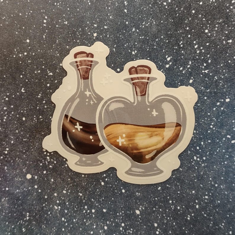 May include: A sticker featuring two potion bottles. One bottle is heart-shaped and filled with a light brown liquid, while the other is a standard bottle shape with a dark brown liquid. Both have cork stoppers and are outlined in gray.