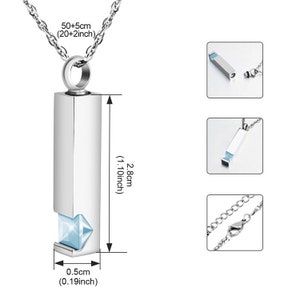May include: A silver necklace with a rectangular pendant that opens to reveal a small blue crystal. The pendant measures 2.8 inches in length and 0.19 inches in width. The chain is 20 inches long with a 2-inch extender.