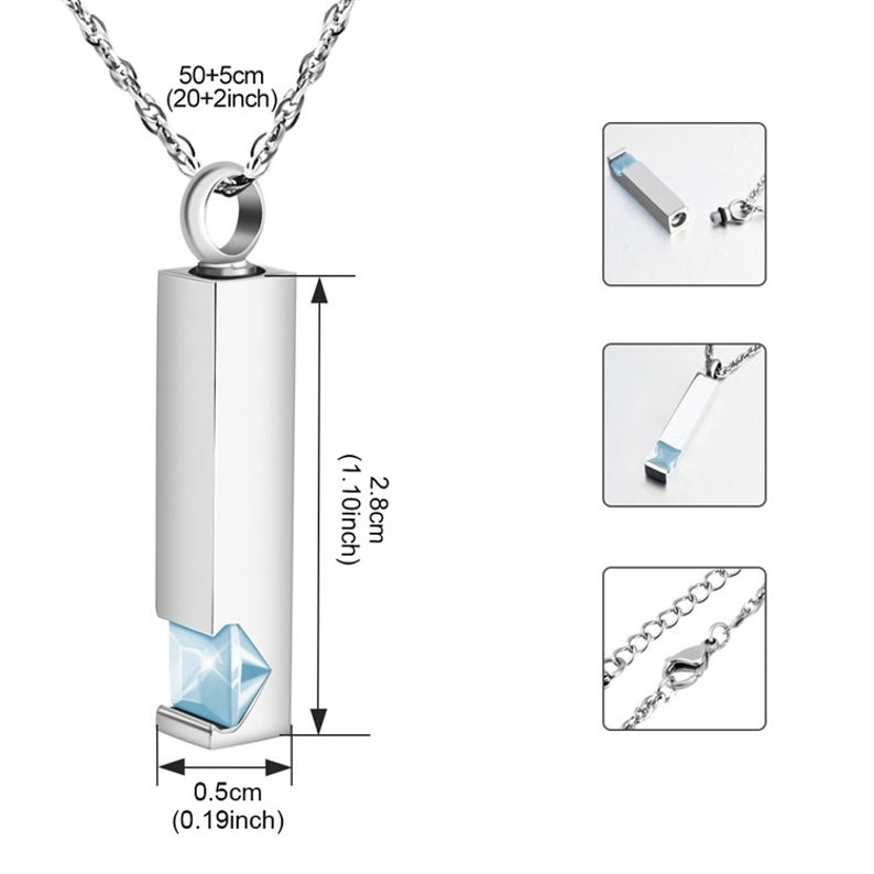May include: A silver necklace with a rectangular pendant that opens to reveal a small blue crystal. The pendant measures 2.8 inches in length and 0.19 inches in width. The chain is 20 inches long with a 2-inch extender.