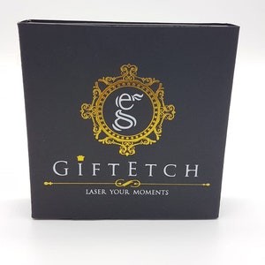 May include: Black box with a gold logo that says "Giftech" and "Laser Your Moments".