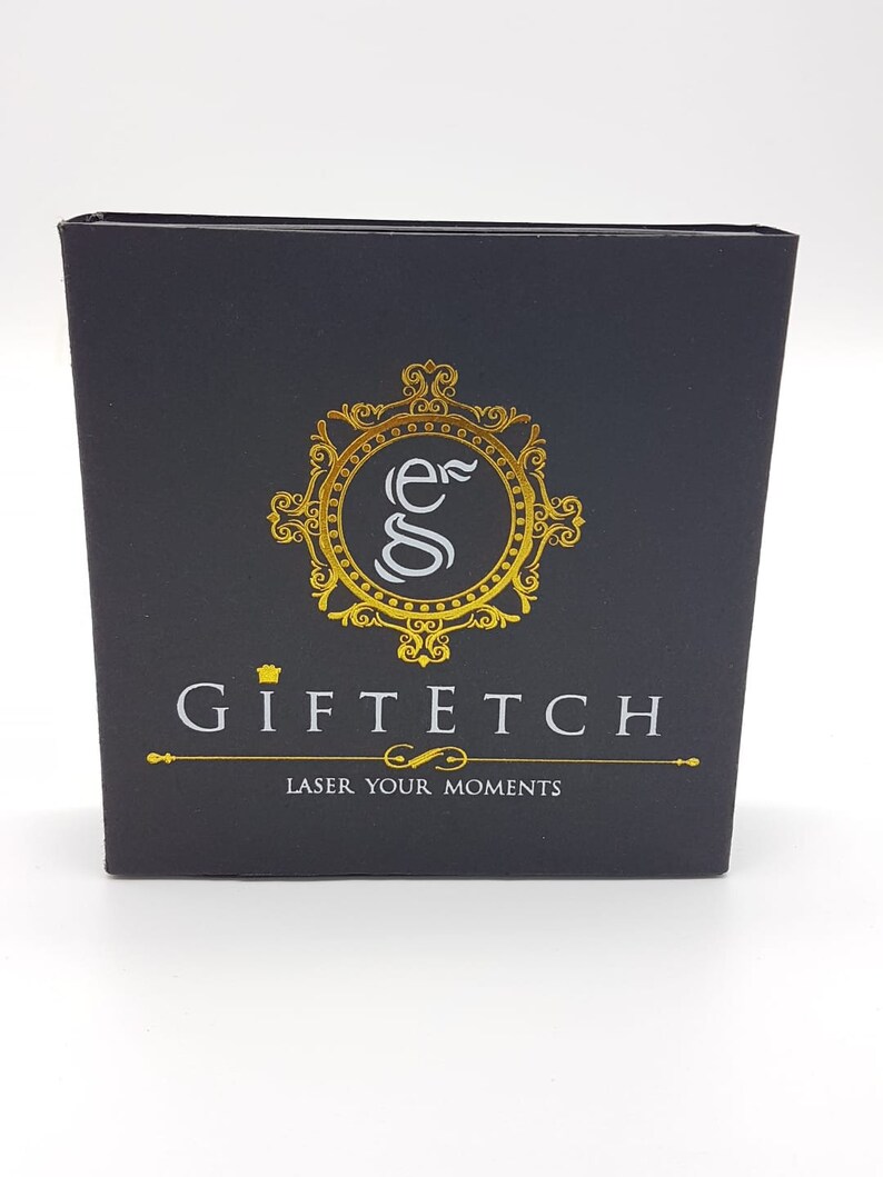 May include: Black box with a gold logo that says "Giftech" and "Laser Your Moments".